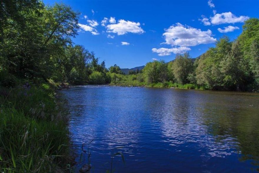 Discover one of the most beautiful Riverfront properties in the Applegate Valley Wine Country. 86 acres with approximately 50 acres of irrigation rights (flood and hand lines). Approximately 1900 feet of Applegate River Frontage! Spectacular location for a private estate or a fabulous new vineyard. Enjoy privacy, and tranquil views from this special property. Adjacent to government lands, currently about 30 acres in grass hay. One of the most spectacular properties available for sale in the Applegate Valley.