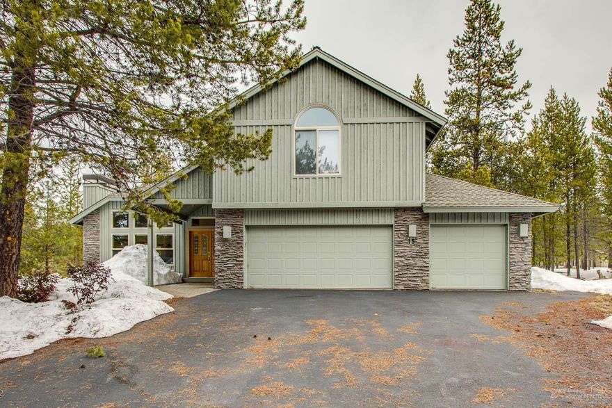 Fabulous, well-cared for 5 bed, 3.5 bath Sunriver home w/ 2 master suites and an oversized 3-car garage. Hardwood floors flow throughout the vaulted great room from the living room w/ a gas fireplace to the dining area w/ wrap-around windows, into the updated kitchen w/ a large island, tiled countertops and stone backsplash, gas range, and stainless appliances. Step onto the back deck to lounge in the sun or soak under the stars in the hot tub! Head down the hallway to find the main floor master bedroom featuring a walk-in closet, deck access and ensuite bathroom w/ dual vanity, jetted tub and tiled shower. A half bath, utility/mud room and 3 car garage w/ built-in storage and workbench complete the ground level. Upstairs are 3 guest bedrooms, a shared bath w/ dual vanity and a tub/shower, and the 2nd, spacious master suite w/ vaulted ceilings and 2 closets. The ensuite bath has a dual vanity and walk-in shower. Situated in the heart of the resort, off a quiet, tree-lined street.