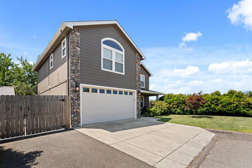 This a very well kept and super cute two story with a fantastic floor plan. The large, open kitchen has beautiful leathered granite countertops, and is open to the great room. Walk-in pantry. Beautiful hardwood floors on the main level. Large master suite and two other spacious bedrooms. A large, nice and open bonus/flex room upstairs. The back yard is easy to maintain and quiet. RV parking. Located near the Rogue X shopping and restaurants. Call for an easy appointment