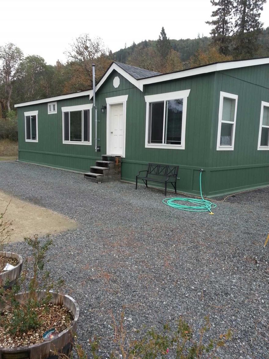 Pride of Ownership, everywhere you look! Just over 10 acres of Beautifully maintained property only one mile from the city of Rogue River ready for you to call home, Backed by BLM with amazing views. This Property has plenty of room for gardening, animals, riding, and exploring! Sitting upon the knoll is a custom 3 bedroom, 2 bath 2014 home with many special touches chosen by the seller, with large picture windows looking out the front of the home to enjoy your sunset. The Kitchen has a large island, and custom cabinets ready for any baker to enjoy. Master suite offers walk in closet and garden tub. Property also includes a 24x30 detached shop, w/Power and a 8X12 Shed next to the house w/ Power. All information deemed accurate but not guaranteed and subject to change at anytime. Buyer to do their own due diligence on condition and uses of the property.