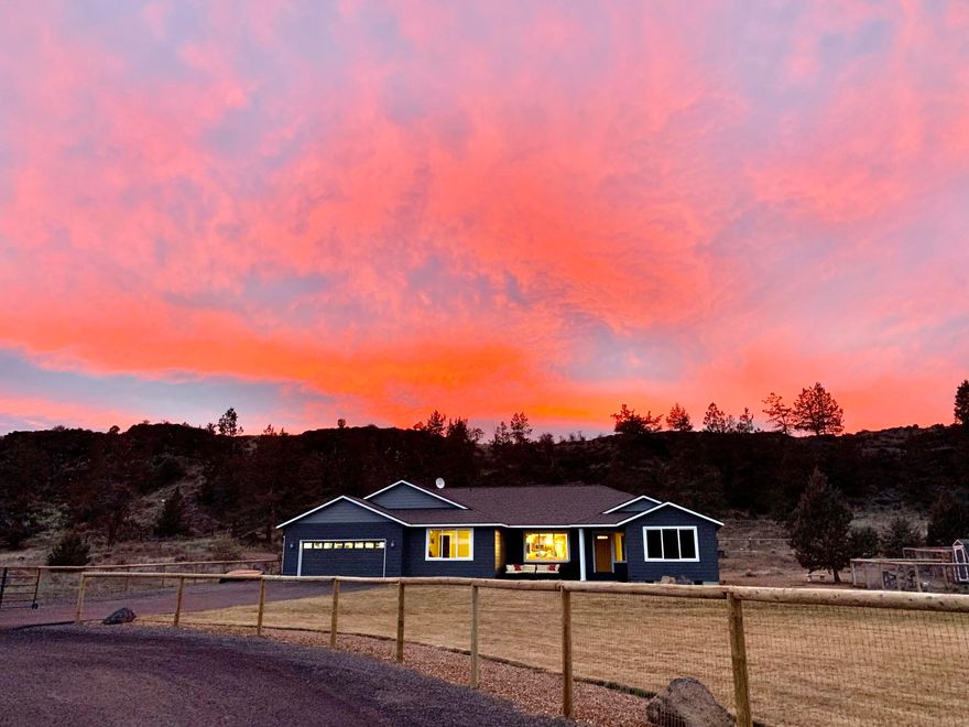 Location, Location, Location! This nearly-new 4 bedroom home is only 5 miles to Redmond, and less than 30 min to Bend. Relax with a cup of coffee and take in the breathtaking views of Smith Rock < 1 mile away. Situated on .71 of an acre, fully fenced, gated & landscaped at the end of a paved cul-de-sac. Open floorpan with great separation and tons of storage. Huge kitchen w/butlers pantry/wet bar, additional fridge and separate walk in pantry. Granite counters with custom soft-close cabinetry throughout. All Whirlpool appliances included! Oversized windows let you take in the views from throughout the house. Luxury Vinyl Plank flooring, and 16'x20' family room to spread out in. 1/4 acre of sod with 8 zone sprinkler system, Aspen Rock, 10'x24' shop, 8'x8' chicken coop with 8'x30' enclosed run. 30'x40' fenced garden with raised sprinklers on separate zone; covered concrete patios front & back are just some of the highlights of this amazing property. RV parking w/power hookups.