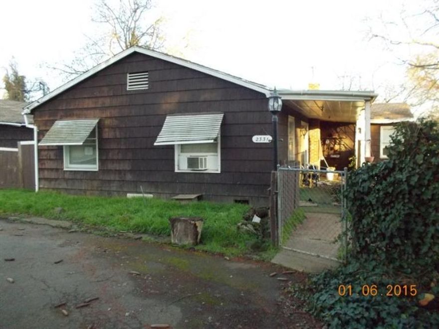 WOW!! This is a beautiful piece of ground (2.2 acres), in quiet, rural Southwest Medford. End of the lane privacy perfect for building your new home. Home needs work or removed. Outbuildings and barn are already there so you can put a horse or two out there. Medford IRRIGATION!!! City water and sewer!! You can't beat this opportunity to live close into town and yet be in the country.