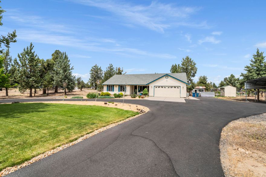 Beautifully maintained 2.3-acre property offering comfort, space, and versatility — with potential to build an ADU! The 1,823 ± sq ft home features 3 bedrooms, 2 baths, vaulted ceilings, and a newer pellet stove for cozy evenings. Enjoy an updated kitchen with a KitchenAid downdraft stove and Fisher & Paykel two-drawer dishwasher. Outside, you'll find a well-kept barn perfect for storage, hobbies, or animals, plus fenced garden areas, greenhouse, and ample RV/toy parking. Additional highlights include a heat pump with cooling, new bedroom carpet, and hookups ready for your hot tub. New roof and skylight installed August 2025. Shown by appointment only.