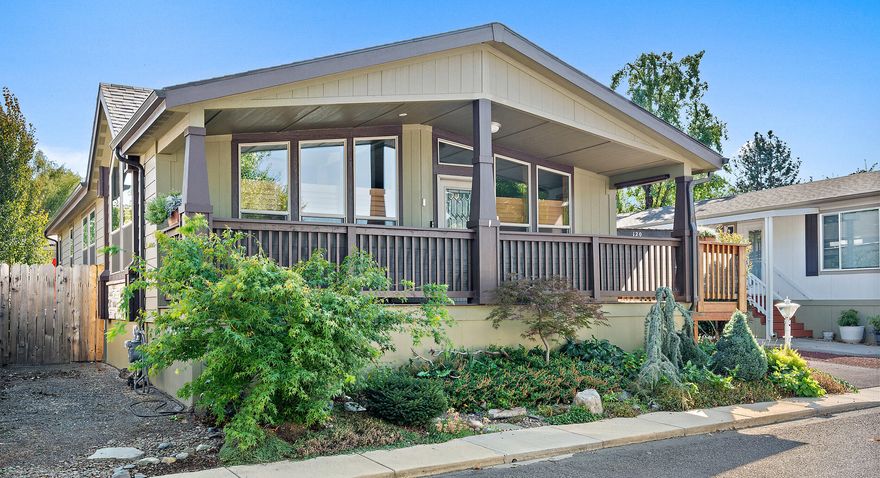 Beautifully maintained 2020 home located in historic Jacksonville! This 2-bed + office/3rd bedroom, 2-bath home offers modern comfort in a charming community with a clubhouse, mature landscaping, and water feature. Enjoy a spacious composite deck with timber beams, vaulted ceilings, trapezoid windows with wood shutters, barn door, and vinyl plank flooring. The light-filled open layout features a large kitchen with hickory cabinets, stainless farmhouse sink, pantry, and dining area. The primary suite includes private backyard access and a luxurious ensuite with tiled shower, soaking tub, and built-in storage. Fully fenced yard with artificial turf, garden area, greenhouse, shed, and carport with storage. Truly move-in ready!