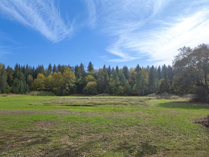 Your Dream Homestead Awaits at 2555 Caves Highway
Stunning 5-acre parcel with the perfect mix of open pasture and mature trees - an idyllic canvas for your custom dream home in a beautiful Southern Oregon setting.
Ready-to-Build Infrastructure:
•	Power, well & septic in place
•	Home Site Applied for
•	Large shop for projects/storage
•	Bath house
•	2 greenhouses
•	Balanced landscape of pasture & shade trees
Whether you're planning a family estate, hobby farm, or peaceful retreat, this property delivers beauty and functionality. The established infrastructure means you can focus on building your vision rather than starting from scratch.
Owner willing to carry with substantial down payment - flexible financing makes your homestead dreams more accessible.
Prime Caves Highway location offers the perfect balance of privacy and convenience. Don't miss this rare opportunity!