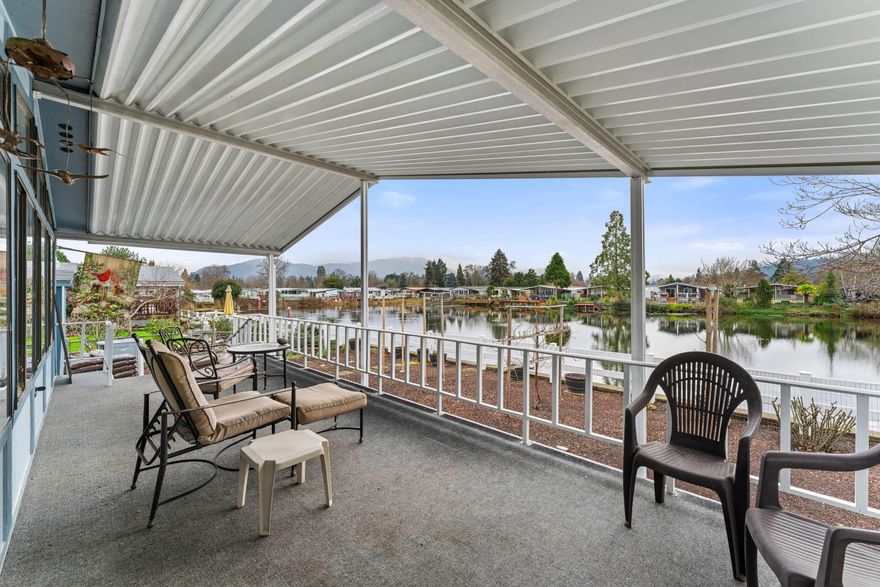 Well-maintained Lakefront home located in Westlake Village, the premier 55+ manufactured home community in our area. Conveniently situated close to town, a city park, and the Rogue River. This home offers spacious main living with vaulted ceilings. The primary suite features a walk-in closet, bath with soaking tub & separate shower. Cooktop, oven, 2 refrigerators, microwave, washer, & dryer included. The outdoor space is landscaped with rose bushes, grape vines, fig trees, hibiscus flowers, & irises, creating a colorful & inviting setting. A tandem carport provides covered parking for 2-3 vehicles. Enjoy peaceful lake views from the spacious 28' x 10' (per seller)covered deck overlooking the lake & garden area—perfect for entertaining. Buyer will need park approval. Buyers due diligence regarding park fees, park rules & other paperwork required by park as well as for condition & intended use including permits & square footage. Monthly rent of $895(per mgr); does not include utilities.