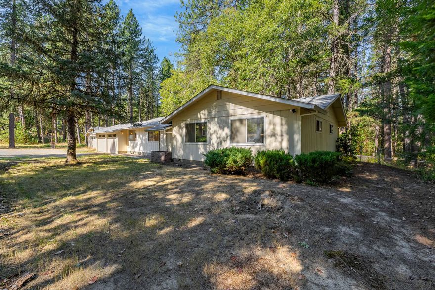 Located in the Jerome Prairie area near Rogue Community College, this 3-bedroom, 2-bath home offers 1,745 sq. ft. of living space with new LVP flooring, carpet, and HVAC. A sunroom adds flexible space for year-round use, and the attached 2-car garage provides convenience. The detached 2-car garage is a bonus, featuring two separate rooms and a full bathroom—creating true potential for an ADU, guest space, or hobby setup. Sitting on just under 4 wooded acres with partial fencing, this property delivers privacy and room to enjoy rural living, while still being close to town.

Disclosure: Property currently shows less than 1 acre; sale is subject to lot line adjustment in process, resulting in just under 4 acres.