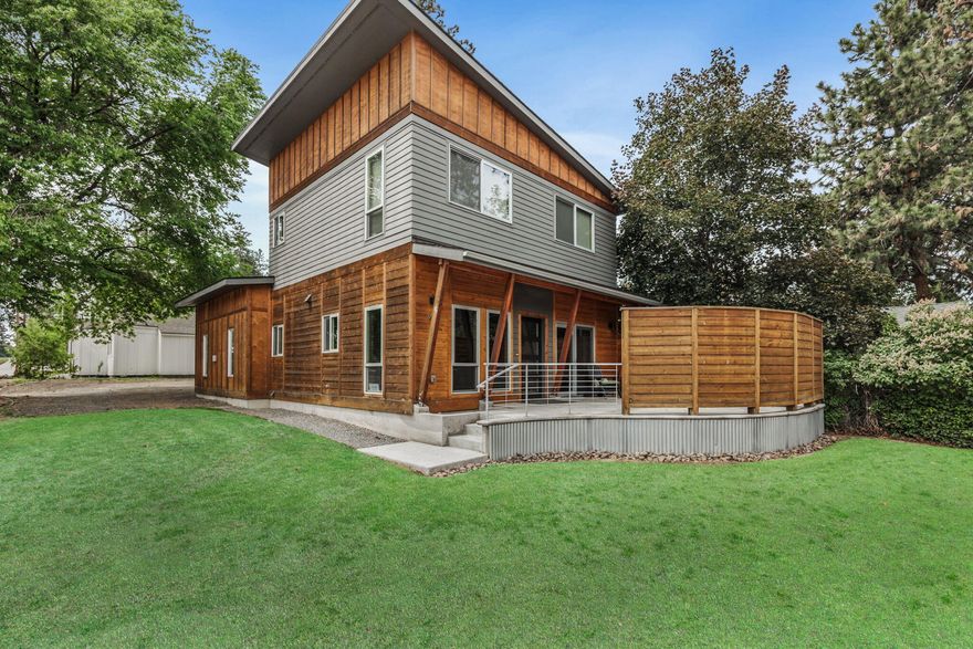 There is a lot to love about this fully furnished Northwest urban-contemporary home located in the heart of Bend's Westside, with a Transferable Vacation Rental Permit & high-end finishes. The open floorplan creates a seamless flow between the light filled great room with gas fireplace, hand stained & heated slab concrete flooring; reading nook; kitchen w/ SS appliances, granite counters, custom cabinets, breakfast bar & dining area with views of sunny front patio. There is also a fenced back patio w/ hot tub, providing plenty of outdoor spaces for summer BBQ's with family & friends. Custom details inc thoughtfully positioned windows & solar tubes that let natural light spill throughout the home, tight knot cedar siding, double roof system, A/C, on-demand hot water. Artistically designed ''Urban Roundabout'' home offers both luxury & efficient living in one of the hottest neighborhoods in Bend. Conveniently located near Downtown, Drake Park, Phil's Trail, Mt Bachelor & Deschutes River