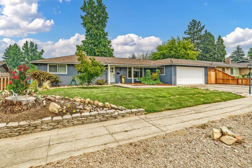 Lovely single level home with a guest house (permitted as a shop only per sellers). Currently home is set up as a 4 bedroom w/2 car garage set up as master. Located on a quiet street very close to Asante hospital this home boasts a gigantic kitchen w/newer gas stove & frig & dishwasher, tile floors & tons of cabinets & a cute pantry. Large living rm with big windows for natural lighting & a family rm w/a wood fireplace . Hallway leads to 3 bedrooms & 2 bathrooms. Gas heater & air conditioner replaced 2 years ago. The rear yard is fully fenced & has a nice garden & lots of privacy. The detached guest house is set up as a studio , apprx 384 sq ft. w/one large rm, small kitchen area & a bathroom, nice deck and a separate entrance at the side of the main home. It was previously rented for $575.00. Garage can be easily converted back .Come and tour this home! You will love the spacious and warm feel! This could be your next home!