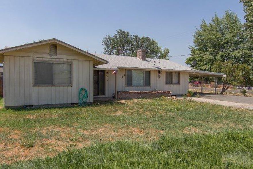 Nice 3 bedroom, 1.5 bath ranch style home on a large corner lot in Phoenix. Natural gas forced air heating system with central A/C. Living room with pellet stove insert in the fireplace. Separate family room/office. Hardwood floors in bedrooms and under the carpet in the living room. Large carport, deck and huge back yard with double gate for RV Parking. This home needs some TLC. As-is Cash sale only. No financing.