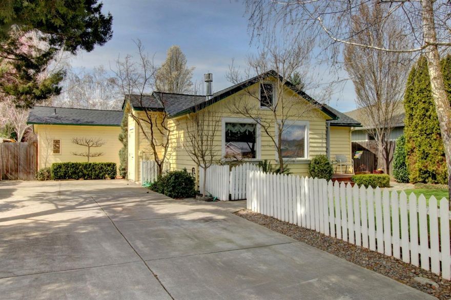 This charming cottage will delight you with its light bright floor plan and spacious backyard! The 3 bedroom, 2 bath, 1,158sqft home welcomes you in to a large living room adorned with a gas stove, perfect for the chilly winter nights. The open kitchen offers ample cabinet space and a cozy eat in dining area with built in bench seating. The Master bedroom is spacious and features a large closet and a fully renovated bathroom with decorative tile and large tub. It also offers access to a private covered patio! The additional bedrooms are roomy and provide plenty of closet space. The huge fenced backyard features mature landscaping, a large patio and detached shed with additional storage space & loft. A new roof was installed last year and a newer HVAC system will keep you cool in the summer months. Don't miss your opportunity to own this move in ready home!