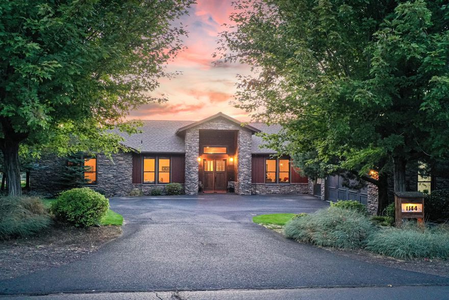 Luxury living in Eagle Crest Resort! This beautiful single level 6 bedroom/4 bath home was built for large family gatherings and cozy spaces. The towering wood doors and the natural stone on the home surrounded by mature landscape gives a sense of the elegance and charm. As you walk in the main living area you're met with a spacious, open concept floor plan, vaulted ceilings, fireplace and a rich blend of wood and stone. Large kitchen island with granite countertops and raised eating bar. Off of the great room is a warm and inviting den where a blend of stone and wood provide natural beauty inside, a wet bar and fireplace completes this room.  Two primaries with ensuite bathrooms with fireplaces and soaking tub. 3 car oversized garage. Soak in the hot tub or enjoy sitting on the deck while listening to the seasonal babbling brook. This home is perfect for everyday living or a destination vacation home with recreational abundance! Centrally located to all of Central Oregon's hot spots