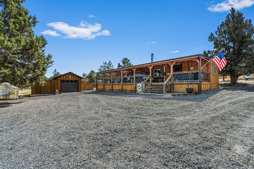Welcome home to this lovingly updated 2 bedroom, 1.5 bath house on 2.26 acres just a few minutes from town. Property is completely fenced and gated with pull thru driveway. Newly added 24x36 2-sided carport/shop for RV parking, as well as a detached garage with workshop addition on one side. There is a nice garden with fruit trees, greenhouse, fenced pasture for animals & multiple storage sheds. Concrete pad was poured for pool area or basketball court. Beautiful views of Mt. Jefferson & Ochoco Mountain range. Home was updated with board and batten siding, metal roof, ductless heating and A/C, Blaze King woodstove, new flooring remodeled bathroom & kitchen with Corian counters, undercount sink, lots of cupboards with slide outs, and updated appliances included in the sale. There is also a family room addition that could easily be converted to a 3rd bedroom, it even has a 3/4 bath attached. Front of house has covered deck the entire length of house perfect for eating & entertainment.