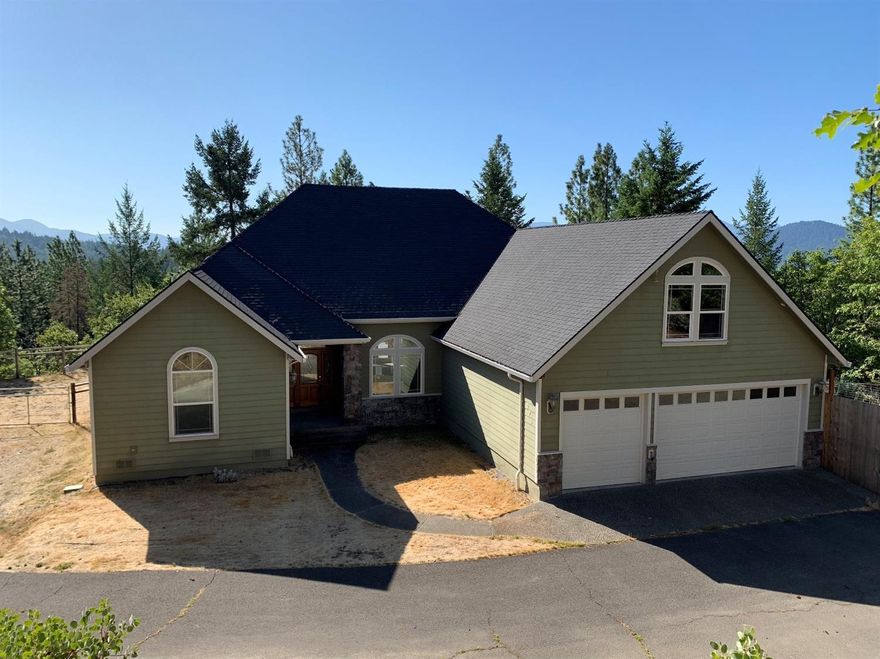 Great custom home situated in a desirable rural neighborhood in Grants Pass. Home offers a large 3 car attached garage with a bonus area above it and room to park your toys outside. There is also a fenced back yard area and raised garden beds on the side. Step inside to this open floor plan complete with custom finishes. Large master suite offers access to back yard, a huge walk in closet and custom bathroom with double vanities and large walk-in shower. 3 more large bedrooms make this a great family home. Light and bright living room lead to great dining nook with great windows and a well appointed kitchen. Come put your finishing touches on to make this home shine!