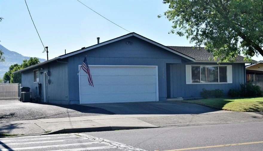 Perfect opportunity for those looking for a clean starter home, or potential investment property. The well designed floor plan makes this 3 bedroom 2 bath home feel spacious. Conveniently located in East Medford, with surprisingly fantastic views of surrounding mountains from the covered back patio. The large fenced backyard is great for entertaining. Misting system in place on the patio for hot summer days! There's RV parking on the side of the home, with power and sewer hookups. Single car garage with shelving and extra storage overhead. In ground sprinkler system for both front and backyard, as well as flowerbed.