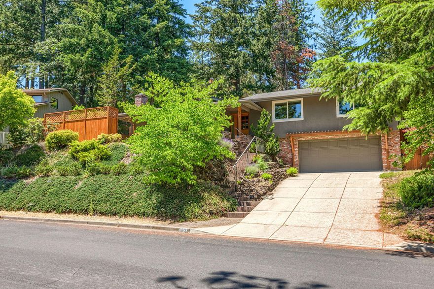 Quiet and peaceful neighborhood with lots of beautiful trees and wildlife. Enjoy this contemporary home with vaulted ceilings, hardwood floors, and skylights to let the light in. The kitchen features granite counter tops, pantry, and gas stove. The heating and cooling are a Friedrich mini-split system. The 2 gas fireplaces can be used for heating the home as well. The backyard is terraced and ready for you to add your finishing touches. There is a workshop area in garage and a storage closet. Close to mountain biking trails.