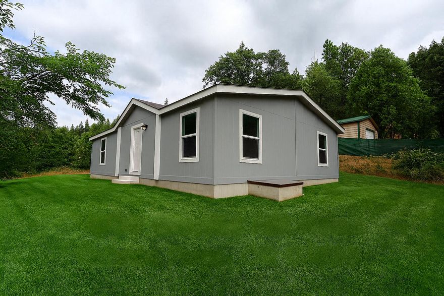 Welcome to this brand-new 2024 manufactured home offering 3 bedrooms, 2 bathrooms, and 1,296 sq. ft. of stylish living space. Inside, you'll find an open floor plan with a bright living area, modern kitchen, and a comfortable primary suite with private bath.

Outside, the property includes a spacious shop, perfect for storage, hobbies, or workspace needs. Backing up to both county and BLM land, this home offers added privacy and direct access to the outdoors—ideal for those who love hiking, exploring, or simply enjoying the peace of nature.

All this while being conveniently located just minutes from town, making it a perfect balance of comfort, functionality, and lifestyle. Don't miss your chance to own this beautiful new home with shop in a sought-after Grants Pass location!