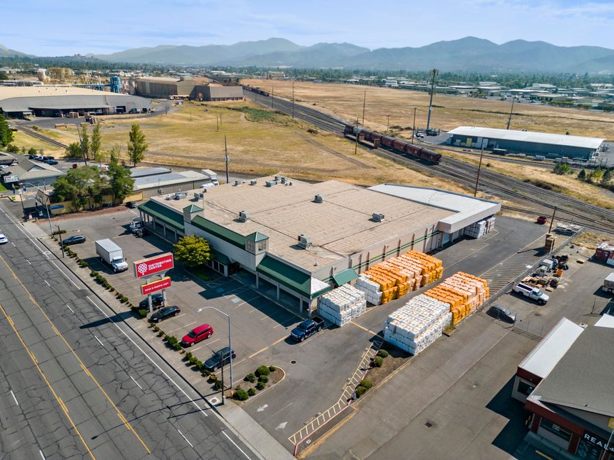 Former Grange Co-op distribution / corporate office building in Medford, OR. This building has a flexible zoning (Heavy Commercial) which allows for a large spectrum of uses. It contains roughly 7,000 sf. of 2 story office space, break and conference rooms, and large open areas previously used for warehousing / distribution and retail activities. The building is sprinkled, nearly all climate controlled, has high ceilings, is fed by a large electrical infrastructure, and is well located. It also has a loading dock, and a paved onsite parking lot. This building should be vacant and ready for buyer occupancy by November 1, 2023.

Notice:  No warranty or representation, express or implied, is made as to the accuracy of the information contained herein; all information contained herein is subject to change, and errors, and is subject to independent verification.  

Please see Private Remarks.  Property to be sold with deed restriction prohibiting competing uses to Grange Co-op.