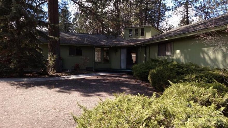 1.07 Acres! Hard to find only 3 minutes to Fred Meyer. Room for shop and toys. Dignified 1976 Vintage, Luxury built, 2296 sq ft ranch with open beam wood ceilings, Huge indigenous lava fireplace, Large spa style bathroom, built-in, oodles of storage. Long drive way makes this property private, Large flat open back yard, House to be purchased as is. Vacant and easy to show.