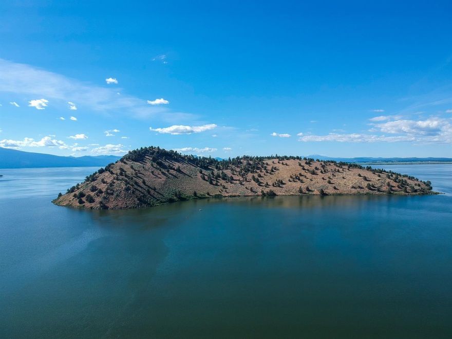 Bare Island in Upper Klamath Lake is available for sale for first time ever! Homesteaded by Grandpa Swift in the early 1900's, the grandchildren are placing the island for sale. Just east of Eagle Ridge on the west side of Upper Klamath Lake, the 50'+ deeep channel between the island & the shore is known for some of the best fishing on the lake. A 1947 Newspaper ad for the island chronicles 20 acres fine tillable soil that will grow almost anything. The family mentions hot springs on the Eagle Ridge end of the property. In the past there was actually a hot springs resort across the channel on the mainland. The sellers will submit a CUP land use app upon accepted offer allowing 4yrs plus a possible 2 yr ext for the new owner to build a residence. Another possible conditional use is private accommodations for fishing for no more than 15 guest rooms. This is a remarkable opportunity to own a piece of paradise.