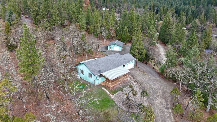 Enjoy peaceful country living near Lost Creek Lake on 1.35-acres in the Evergreen Meadows Subdivision. This 3-bedroom, 2-bath, 1,364-sq. ft. home, built in 1997, features vaulted ceilings, quartz countertops, kitchen pantry, laundry room and a spacious primary suite with walk-in closet, double sinks and walk-in shower. Relax in the sunroom or on the covered 12x30-deck, and stay comfortable year-round with new mini splits (2024). The property includes an attached 2-car garage, a 24x40-shop with workbenches, RV parking and a fenced yard for dogs. Zoned RR-5 with cul-de-sac location, public water through Evergreen Meadows Water Improvement District and septic system. Outdoor enthusiasts will love nearby fishing, rafting, hiking, boating, and skiing, plus Crater Lake National Park and Diamond Lake Resort are just an hour away.
