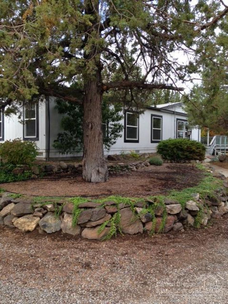 Quiet and Secluded Yet Not Far From Town! Plenty of room for your toys and critters! Immaculate inside and out, 1300+SF garage/shop, covered carport. Home features open floor plan, vaulted ceilings, laminate & tile, formal and informal dining areas, french doors lead out to a awesome patio area, decking plus very nicely landscaped. The 10 acres is fenced & has a large area once used as a corral/arena with a 1100+ SF concrete slab.