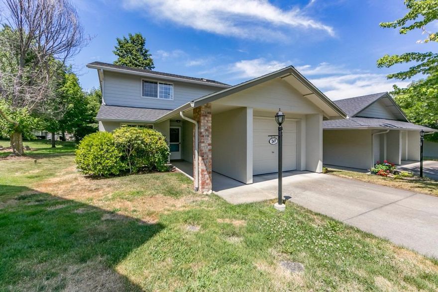 This end unit townhouse is filled with natural light and will pleasantly surprise the most discriminating buyer. The main floor features a roomy kitchen, complete with ample storage, durable and stylish flooring and updated countertops. The adjacent dining room has slider access to the fenced and private back patio and small yard. There is a vaulted great room, laundry room, spacious bedroom and full bathroom also on this level. Upstairs in a very spacious, secondary suite including a private bathroom. This well maintained home is part of an 18 unit townhouse association. HOA fees are quite reasonable at $120 per month and cover the exterior of the buildings as well as landscape maintenance. Newer siding, roof, paint and more. Attached garage, ample side yard. Don't miss this incredible opportunity to live in a beautiful and affordable Ashland property.