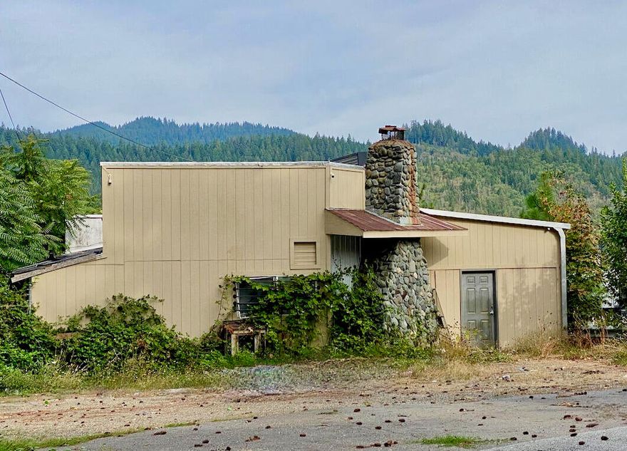 Freeway exposure offers great opportunity with this Rural Commercial property in Josephine County! Ideal location for gas station with access from North and Southbound traffic at the freeway on-ramp across from Sunny Valley RV Park. The main building was formerly used as a restaurant, night club, and dispensary. Gas station permitted per County! Small out-building with a kitchen and bathroom next to the main building which could be a studio apartment. Estate sale, sold as-is. Personal representative can not make repairs or improvements and makes no warranties regarding size, uses or condition of buildings or equipment. All information is deemed accurate, buyer to verify to their own satisfaction.