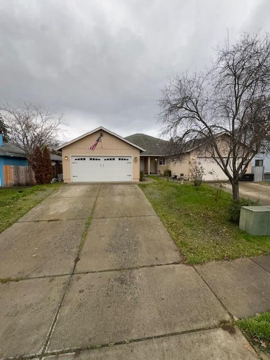 Comfortable and spacious zero lot line home. One wall shared with the neighborhood unit.  No HOA.   Well-kept 3-bedroom 2-bath house in a quiet neighborhood and close to shopping, schools and 1-5 access.  Updated kitchen with stainless steel appliances. Fresh interior paint.  Large attached 2 car garage w/ utility sink, laundry nook, additional parking. Spacious low maintenance fenced yard with storage shed and covered patio.  Family and pet friendly neighborhood.