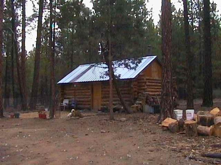 Land Parcel With Well And Storage (Cabin). Septic Approval But Not Installed. Power To Edge Of Graveled Road Frontage. 2.3 Acres In The Pines.