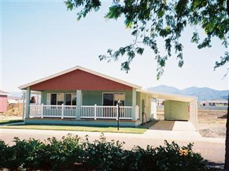 PRICE REDUCTION: Eco-friendly energy star 55+ park. 2007 Marlette. Vaulted ceilings. Large living room, formal dining room. Delightful kitchen with a curved, raised eating bar. Alder cabinets with alder slab doors. Can lights. Den w/double doors, built-in bookcases & computer desk. Recessed medicine cabinets in bathrooms, MBR bath has step in shower with double seats. Cemplank Lap Exterior. 24' X 8' covered front porch with cedar decking and white vinyl railings. Home is set up on a permanent cement block foundation. Has great views of the mountains. Home comes with a five year warranty.