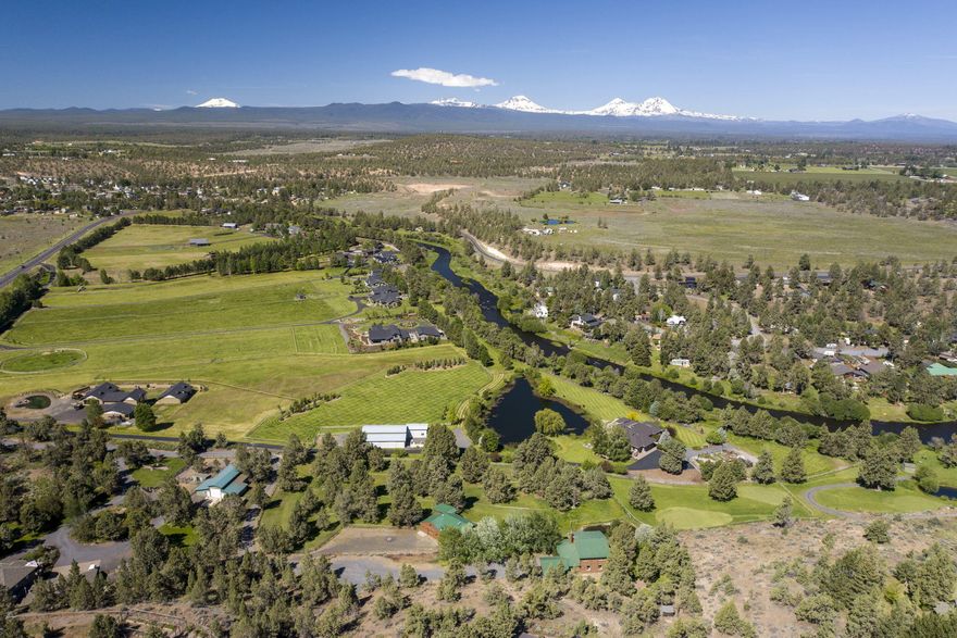 A refreshing summer breeze from the Deschutes River gently sweeps across your face and lifts your smile as you take in unobstructed views of the majestic Cascade Mountains.  This could be your reality if you choose to invest in quality of life and secure this one of a kind, 4.32 acre property!  At roads end, perched into the hillside, you will discover a 3192 sq ft, 4 bed, 3 bath, log home. Oriented to provide complete privacy while taking in incredible mountain views, this home overlooks beautiful, treed pastures, pond and large shop with ADU. Whether looking for stunning mountain views, Deschutes River access, room to breathe, a hobby farm, peace and quiet, a unique rental, future development possibilities or anything else you can dream up – this property is worth a visit! 
Located just one mile from the heart of Tumalo and only 6 miles from Downtown Bend, this amazing property offers endless possibilities!