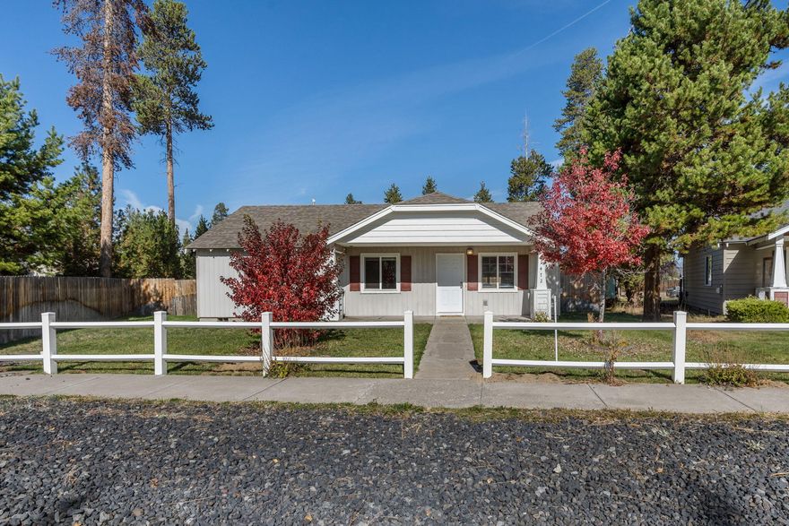 Nicely updated single level home on an oversized 1/3 acre city lot. The home features a great room floorplan with vaulted ceilings, a butcher block island and gas fireplace. New waterproof plank  flooring throughout the home. Large master bedroom with walk in closet. Natural gas forced air furnace and attached two car garage. The covered front porch and fenced back patio are surrounded by lawn with new inground sprinklers. The large back yard is graveled for RV parking with room to build a shop. Priced under market value and seller is motivated.