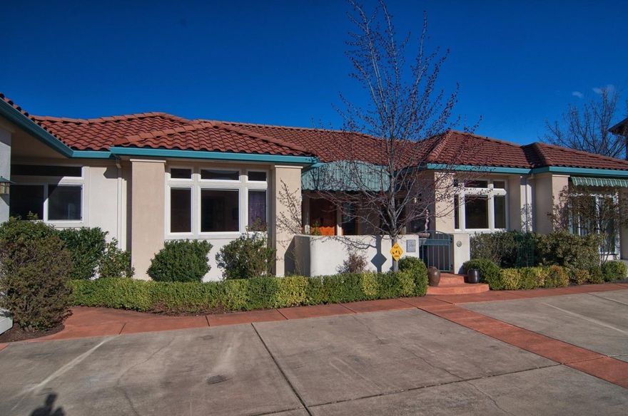 A stunning Mediterranean-style home, in what is fast becoming the wine country'' of southern Oregon, awaits its new owner. The home sits on a terraced hillside lot that is fully landscaped and irrigated and nearly half an acre, in a very desirable, quiet neighborhood. Its' location on a ridge above Ashland provides stunning views of the city, the Rogue Valley, and the surrounding Cascade and Siskiyou mountains. The interior of the home is sunny and open and built with quality workmanship utilizing the best materials. Special features include tall ceilings to let in maximum light, expansive windows to take in the amazing views, and gorgeous wood floors, doors, and trim. The open kitchen includes granite counters, two sinks, Dacor oven and range, and twin Fischer-Paykel dishwashers. The kitchen area is surrounded by a lovely wrap-around deck for outdoor dining or relaxation. The Master Suite has the most spectacular view and a private balcony from which to enjoy it. All living s