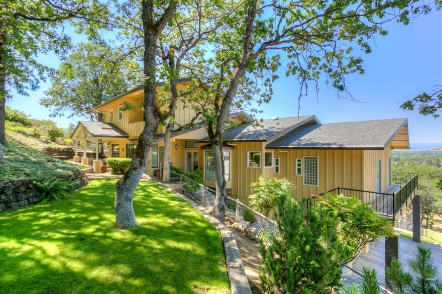 Amazing views from almost every room! Located on .59 acre at end of private driveway, it offers privacy and convenience to shopping and schools. Extensively remodeled over the years w/ hardwood and tile floors, sliders or French doors to covered patio and decks, and newer kitchen. From the moment you enter you will appreciate this meticulously maintained and light-filled home. Living Room w/wall of windows, vaulted ceiling and adjacent formal dining room w/ dumb waiter. Cozy den w/ gas freestanding fireplace. Newer kitchen w/ granite counters, high-end stainless appliances, eating bar plus nook w/ bay windows overlooking backyard. Master Suite is spacious w/ walk-in closet, tile bath w/ vanity. The other end of Main level has two guest rooms and full bath. Upstairs are 2 guest rooms and full bath. The beautiful inground pool, putting green, horseshoe pit and basketball goal provide lots of outdoor entertainment. Beautifully landscaped and large off-street turfstone/RV parking.