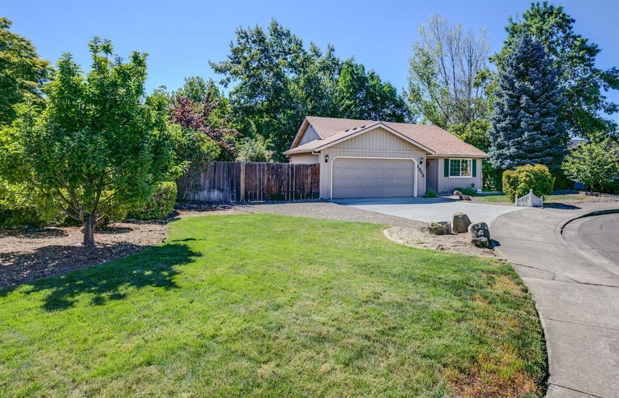 Fantastic quiet Culdesac location in East Medford with 1282 sqft, 2 bedroom/ 2 baths on a large .19 acre lot. Located in Abraham Lincoln School District This home offers an inviting open living floor-plan with vaulted ceilings that includes a large living room, dining area & updated kitchen with bar seating. No work needed & move in ready with new wood laminate & carpet flooring throughout, fresh interior paint, new doors & trim, & refinished cabinets with beautiful granite counters in the spacious kitchen! Large front yard area with mature landscaping. Enjoy the covered deck in the easy care back yard with lots of trees providing a comfortable and private setting! Side area for possible small trailer parking with large gate as well as a 2 car garage with tons of shelving and storage. Conveniently located close to schools, shopping, and parks with all the attractions Southern Oregon has to offer! A must tour home!!