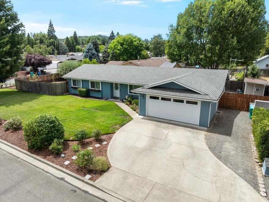 Beautiful home sitting on a large residential lot. This recently updated home has 3-bedrooms, 2-bathrooms with 1,673 sq ft of living space. Inside, you'll find an extra family/living room making the home feel more spacious and great for entertaining. 

The front yard features a well kept lawn, rose beds with an in-ground sprinkler and drip system. In the fully fenced backyard, a deck and patio for relaxing, plus mature apple and peach trees with irrigation rights. There's also a shed for extra storage equipped with power, a/c and internet cable available.  The garage even has a generator hookup.

Recent updates include new roof and heat pump added in 2017, updated ducting in 2019, exterior paint and pressure tank in 2020, attic insulation added in 2021, underfloor insulation, well pump and drop pipe installed in 2022.

This move-in ready home is a must-see