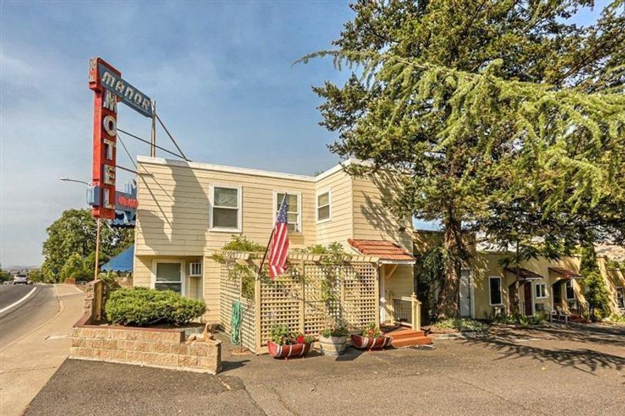 Dynamite Opportunity in the Heart of Ashland! *Offered for $949,000 all cash, or $995,000 owner-financed*. Own a charming & popular Ashland hospitality business w/long-standing, repeat clientele & solid net operating income (8+% cap rate). The historic Manor Motel & Auto-Court features 12 Calif-style bungalows (1-2 BRs ea, 7 w/full kitchens, 7 garages, 1 apt suite w pvt backyard) plus a 3BR Owner's or Mgr's residence (or as add'l guest lodging/rental income). Sited on .46 acre w/lovely mature landscaping & a tree-canopied courtyard w/outdoor picnic area, this charming hideaway is just a few blocks from Ashland's famed Plaza, restaurants, theatres, galleries, shops & Lithia Park. (Arch. plans avail. for possible expansion/remodel). Refinished/refurbished Jan-May 2015. *Seller will finance 3-5 years at 5%/yr w/$600K down + verification of buyer's financial qualifications. Under current family ownership for over 20 yrs, owner retiring. By Appt only: Barbara Argento,541-621-5393