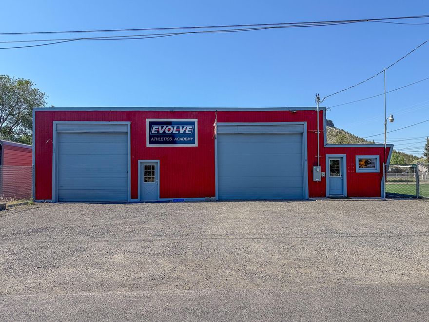 Versatile 3,000 square foot commercial building on a corner lot, zoned NC for a variety of uses. Features two roll-up bays (12 foot doors), with, 15 foot and 14 foot ceilings. Includes an office, storage room, restroom, and updated electrical panel with 3-phase power. The fully fenced 5,000 square foot yard with turf. Plus, 4 off-street parking spots. Built in 1938 and well-maintained, this property offers great functionality, visibility and flexibility for your business.