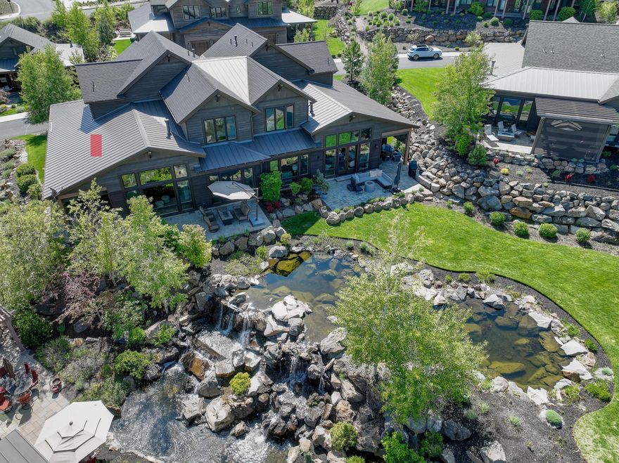 Beautifully appointed townhome at this coveted location in Tetherow! As one of the best situated Triple Knot homes, you will enjoy views of landscaped ponds, green space, and the Cascade Mountains. Inside and out, this home has been meticulously maintained by the original owners and is graced by generous windows, a tiled floor-to-ceiling fireplace, hardwoods and solid surfaces. The main floor living space boasts a beautiful great room with 13 foot ceilings, a chef's dream kitchen, private den/office, Primary Suite/bathroom, and a well-appointed mud/laundry room off of the two-car garage. Lovely and open staircase leads to two additional second-floor suites with the west-facing suite displaying epic mountain views. This home offers luxury living, with HOA exterior care, and provides ample space to live out your dreams in Central Oregon.