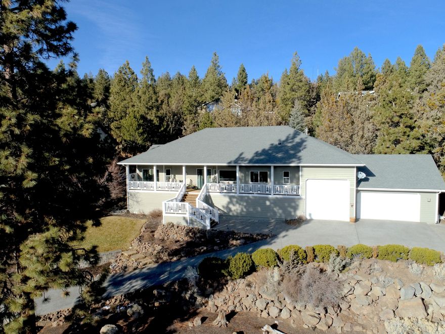 Four roomy bedrooms PLUS an office, 3 car garage with an RV bay and TONS of storage.  All of this on Bend's sought after west side.  Enjoy the sunset looking out over the Old Mill  from your inviting covered front porch.  Entertain inside and outside with two sets of french doors that lead from the great room to the huge partially covered deck.  This large .62 acre lot has a water wise front yard and lawn with sprinklers.  The backyard has a 4 tier water feature, raised garden beds, and private hot tub.  This house is move in ready with a new roof, newer energy efficient forced air gas heat and central AC, and new energy efficient hot water heater.  You'll enjoy the new interior paint, carpet, updated bathrooms and top of the line kitchen appliances.  Additional unfinished basement spaces not included in the square footage add to this house living large!  Community tennis (or pickleball) courts with affordable HOA of $350/year.