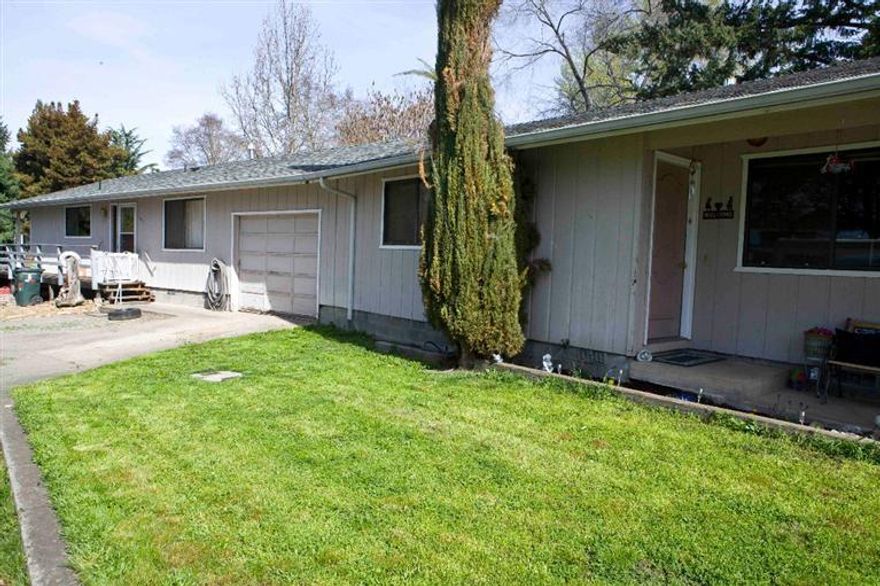Eagle Point duplex on beautiful Butte Creek. Large 2 bedroom, 2 bath with garage, rents for $700 and very nice 2 bedroom, 1 bath with carport rents for $650. Live on the water and have your tenant help pay the mortgage! Great investment opportunity in Eagle Point.