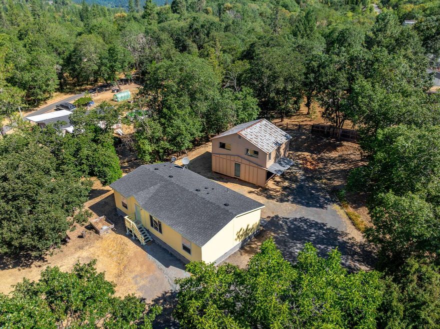 Charming rural property on 1.33 acres with room to grow. Built in 2020, this 1,296 sq ft home features 3 bedrooms, 2 bathrooms, and an open floor plan designed for comfortable living. Enjoy the peaceful country setting with plenty of space for gardening, animals, or outdoor hobbies. A versatile two-story shop offers ample room for projects, storage, or other multi-use potential. (Shop building is being sold as is) Buyer to perform their own due diligence into all aspects of the property with the appropriate agencies for condition, permits, zoning and intended uses.