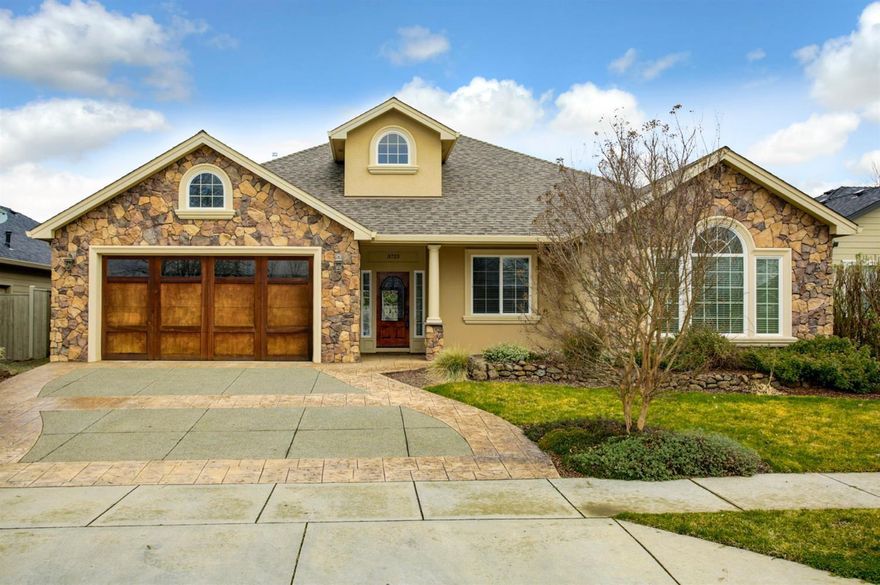 Don't miss this single level, stunning East Medford Craftsman home in established and desirable Stonegate Estates! You will love the way this home feels from the moment you enter. Gorgeous stone & stucco exterior with covered porch, rock wall and mature landscaping. Popular floor plan with open concept main living areas & split floor plan. This spacious floor plan offers wonderful great room with vaulted coffered ceilings with wood beams, custom rock fireplace with built-in shelving on each side & arched bay window. The large dining room is open to the lovely chef's kitchen with granite counters, hardwood flooring & walk-in pantry. Large master suite boasts a lovely master bath with jetted tub, double vanity, spacious walk in closet & private water closet. French doors lead to the low maintenance and private backyard and covered back patio, perfect for summer entertaining.