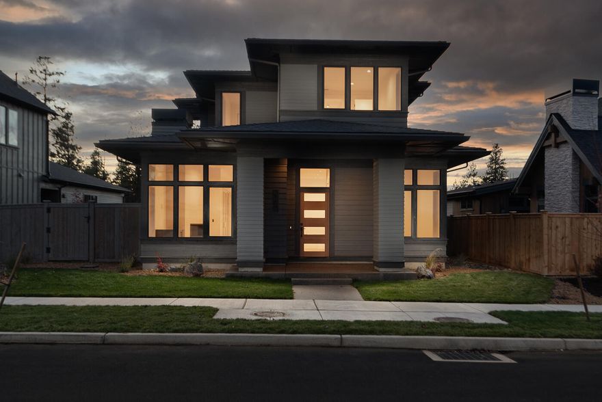 Welcome to Discovery West, a new residential community nestled on Bend's westside. This home meticulously crafted by Structure Development NW showcases a contemporary design, combining clean lines, sleek finishes, and natural elements to create a timeless aesthetic. Open floor plan maximizes space and functionality. High ceilings and large windows flood the home with natural light, illuminating the carefully selected finishes and creating a welcoming ambiance. Kitchen features top-of-the-line appliances, ample storage, and a central island. Dining area transitions to a spacious great room, perfect for relaxing by the fireplace. Covered terrace for outdoor living. Primary suite on main level with ensuite bathroom featuring premium fixtures, a walk-in shower and large closet. Home office, half bath, laundry and mud room also on main level. Bonus room, two bedrooms and full bathroom on upper level. Nearby amenities include schools, restaurants, shops and recreational opportunities.