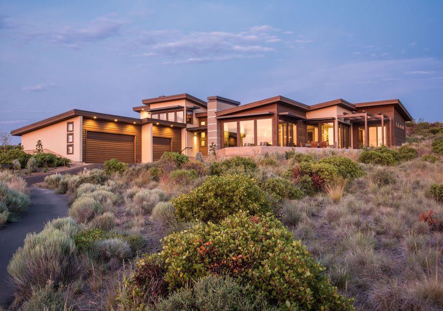 This amazing modern home in the highly sought-after Shevlin Commons neighborhood was lovingly created by the current owners and built by the talented staff at Sun Forest Construction. Located  minutes from DT Bend, this elegant residence is nestled at the edge of thousands of acres of Deschutes National Forest and neighborhood adjoins Parks and Recreation land that makes hiking and mountain biking available out the front door. The Cascade Mountain Views are simply breathtaking and provide an ever-changing panorama. Open floor plan and lots of windows take advantage of the views. Home includes a 1,050-bottle wine room off the well-planned chef's kitchen.  Private interior/gated patio, great for pet area.  Two master suites main-level, 3rd BR ensuite upstairs (3rd BR currently being used as 2-person office) Mountain views are incredible! Clean lines, state-of-the-art, high-end finishes with 4-separate heating/cooling zones.