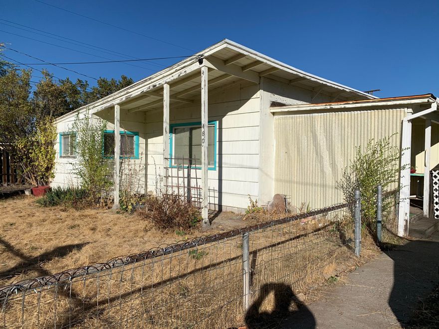 Charming cottage in the heart of Prineville. 1250 sq feet of living space ready for your finishing touch. 2 car garage with shop area. Courtyard off front porch. Home has been well loved for many years and now needs a new owner to give it some needed TLC and make it their own.
