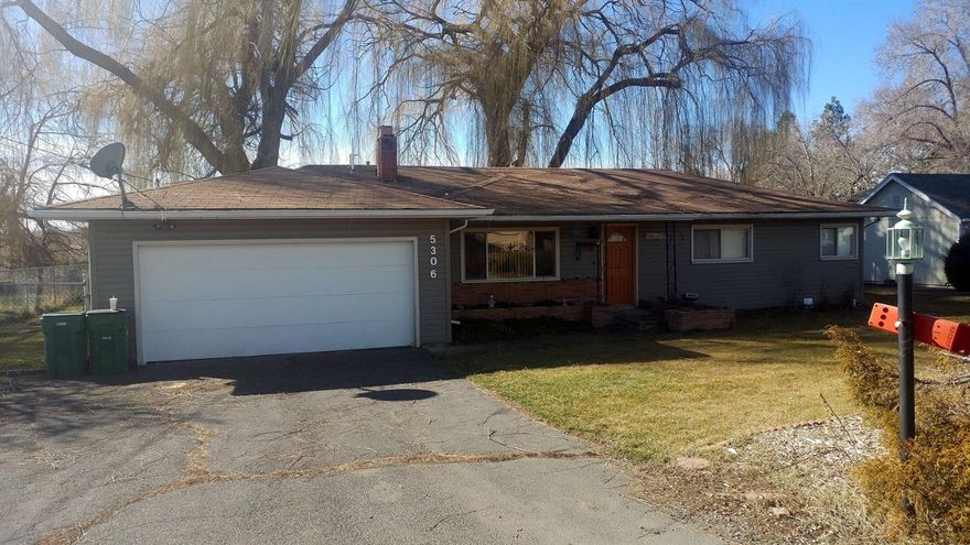 Check out this great family home on a huge lot (.63 acres) with room for a shop. 3 bedrooms 1 bath in the middle of the suburbs between Homedale and Hope. With almost 1300 square feet there are many opportunities for all kinds of buyers. The home boasts a great layout with large bedrooms and bath, a dining area off the kitchen and a laundry/mud room that leads out to the huge covered patio perfect for family time or entertaining in the backyard. The fully fenced rear of the property has plenty of space for a shop and much more. With a 2 car garage, large space for RV or toy parking and back yard access on both sides of the home. The front yard has mature landscaping and in-ground sprinklers for great curb appeal. Don't miss a chance to view this one!