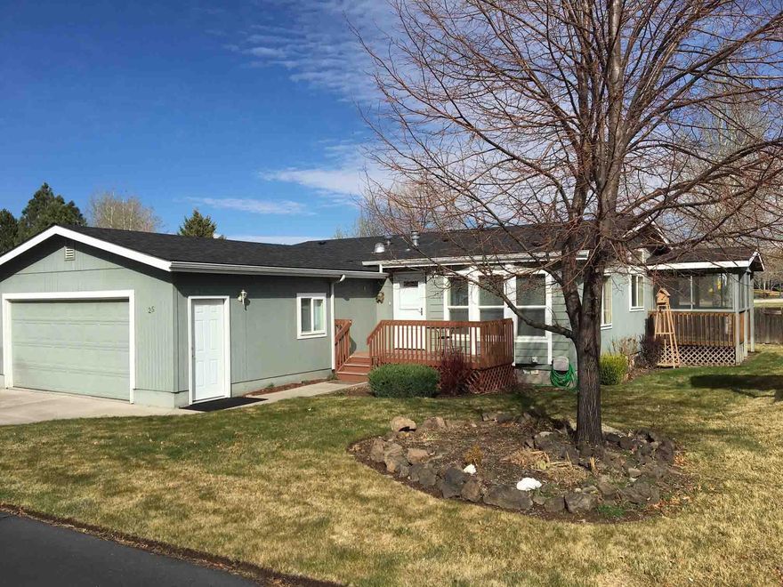 Outstanding and Beautiful triple wide home in highly desired 55+ Snowberry Village near hospital shopping. Backs up to Providence Park with a gate to slip right into huge open spaces. Providence Park is right out your great room windows. Space Rent $625/month includes water, sewer, clubhouse, snow removal and mowing. Backs to Public Park with gate to it.  Great Room with a distinctive red gas stove hosts the kitchen with quartz counters,  large deep pantry, dining & den area & even a small chef's desk. Sliding doors lead to the covered, screened in porch.  A formal living room is just inside the front foyer. The huge primary bedroom with ensuite bath has a large walk-in closet. A new roof 3.5 year ago; Newer Carpet; Laminate flooring; Gas Furnace with newer AC system all add up to one fine home.  Rentals are not allowed in Snowberry Village. Space Rent is $625 per month, includes Water, Sewer, lawn mowing, snow removal, clubhouse & yard debris pick up.