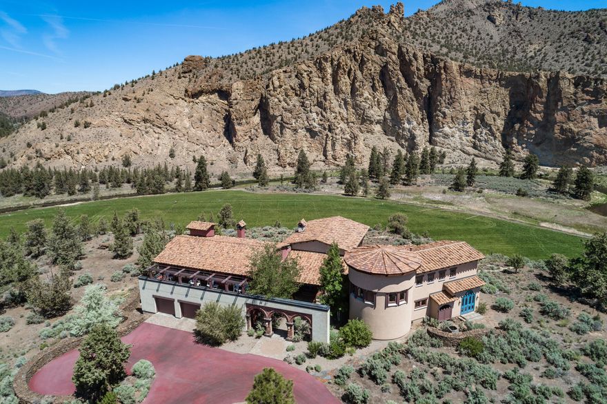 Sometimes it is all about the view. This central Oregon dream property offers stunning views for miles. Canyon Crest is an artfully designed estate situated on 11 acres in private, secluded Ranch at the Canyons. Embrace natural beauty from every window. This private oasis offers panoramic views of the Cascade Mountain range, Crooked River, osprey, eagles, and canyons of Smith Rock State Park. Enjoy fly fishing on 2 private miles of the Crooked River along with shared ownership of stables, clubhouse and vineyards. Built by award winning builder with quality craftsmanship throughout. Gourmet kitchen with Miele appliances including steam oven and warming drawer.The use of reclaimed wood flooring is just one of the custom details. Volume ceilings, open living spaces. Enjoy indoor and outdoor fireplaces.Bonus rooms include 2 private office spaces, theater /screening room, art studio, 2 wet bars. Extensive detailing including elevator.